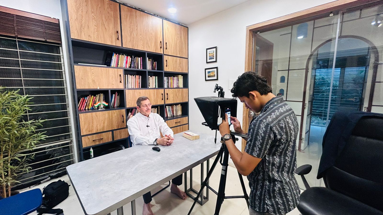 Interview setup with teleprompter and camera on a tripod