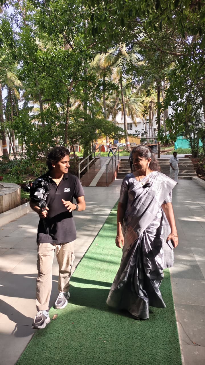 Walking and filming a subject on location